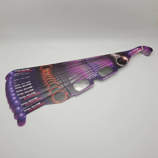 A stack of purple solar eclipse glasses.